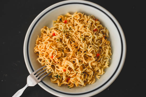 istock Noodles and vegetables on a plate. horizontal view from above 1338050315