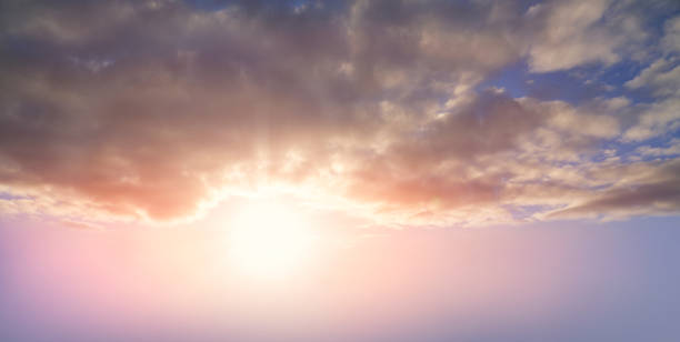 istock Dramatic sunset background of orange and yellow clouds 1338053417