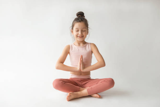istock Cute Girl Doing Yoga 1338056497