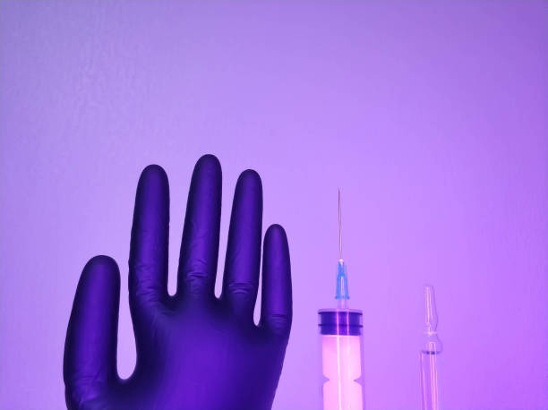 istock Syringe and ampoule on a light background close-up. 1338056566