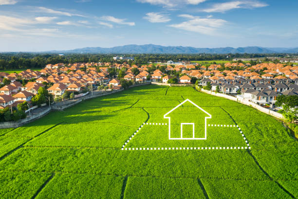 Land or landscape of green field in aerial view and home or house icon. Land or landscape of green field in aerial view or bird eye view. Include agriculture farm, icon of residential, home or house building and land plot. That real estate or property for dream concept to build, construction, owned, sale, rent, buy, purchase, mortgage and investment in Chiang Mai of Thailand. Conspiracy stock pictures, royalty-free photos & images