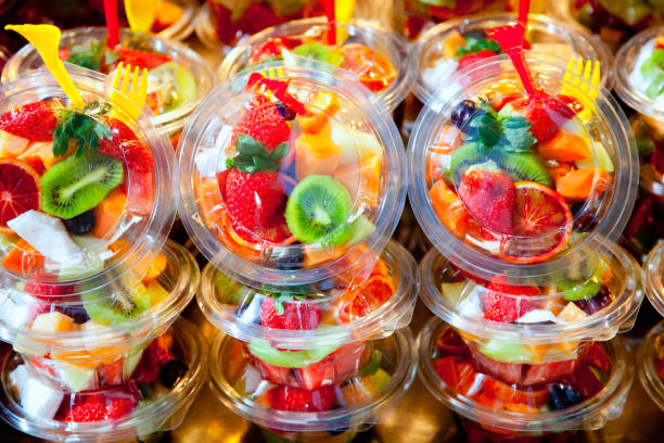 istock Colorful fruit salad in transparent glasses 1338058974