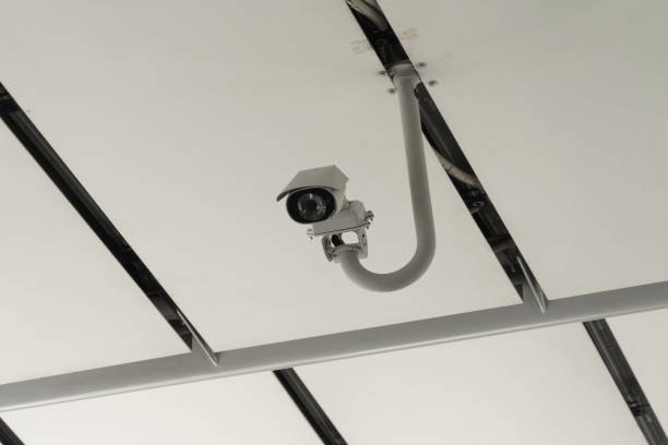 istock CCTV security camera or closed circuit television at building exit way. Digital safety and motion recorder. Video surveillance. Technology monitor. 1338059638