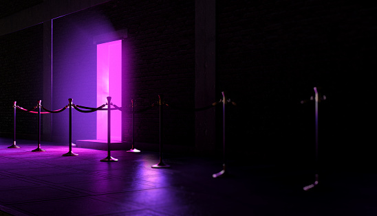 An evening scene outside a nightclub entrance emitting a pink light and an empty queue demarcated with barrier posts and rope - 3D render