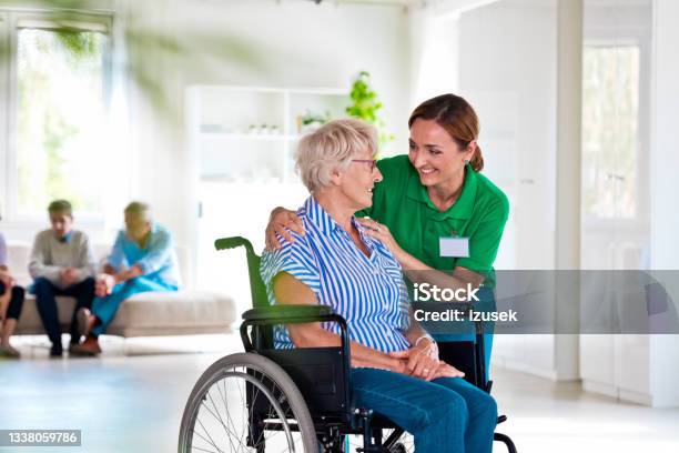 Female Social Worker Supporting Senior Woman Stock Photo - Download Image Now - 70-79 Years, A Helping Hand, Adult