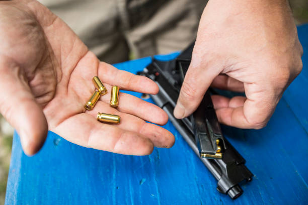istock Close-up of Man Holding Blank Ammunition 1338059816