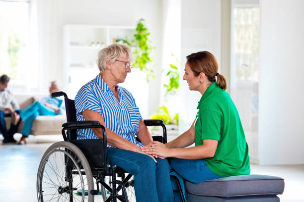 istock Home nurese consoling senior woman 1338060363