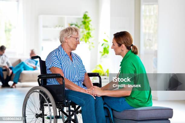Home Nurese Consoling Senior Woman Stock Photo - Download Image Now - Nurse, Patient, Distraught