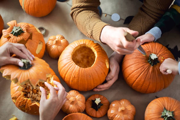 istock Making pumpkins for Halloween by family 1338060501