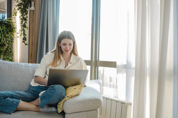 istock Relaxing and using laptop at home 1338060789