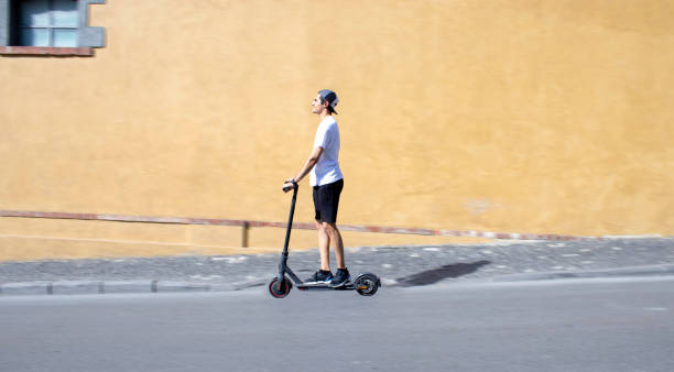 istock riding electric scooter in the city 1338061637