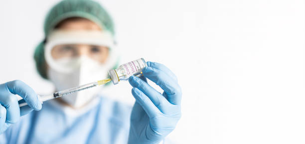 istock Nurse loading a syringe with Covid-19 vaccine. Pandemic concept. Selective focus. 1338062585