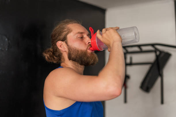 istock Man trains at home while alone and isolated by COVID 19 1338066765