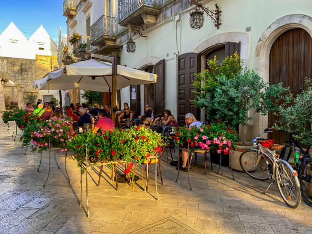Locorotondo, Italy - August 8, 2021: Picturesque street in the old town.