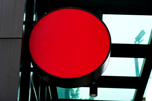 Red blank Circle mockup signboard at store or shop