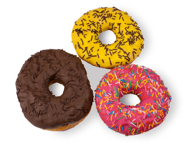 istock Three donuts covered with chocolate and sugar icing and chocolate chips isolated on a white background 1338071448