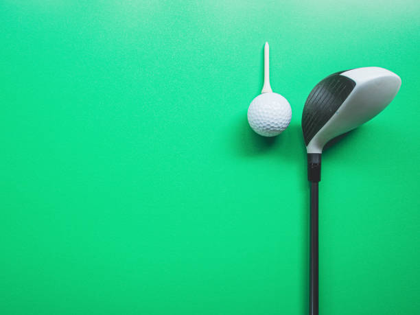 istock Golf equipment flat lay on green background. Top view 1338072454