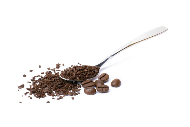 istock instant granules coffee with roasted coffe bean isolated on white background. 1338074404