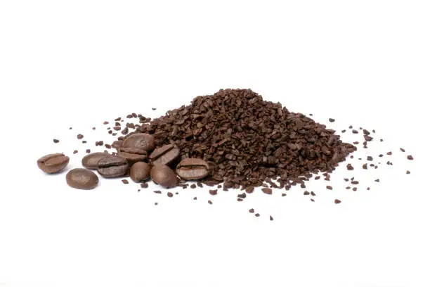 Photo of instant granules coffee with roasted coffe bean isolated on white background.