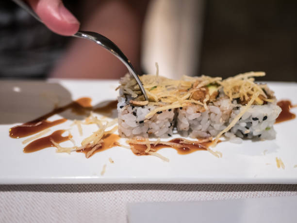 istock Typical Japanese dish of sakura roll on a white plate. 1338074760
