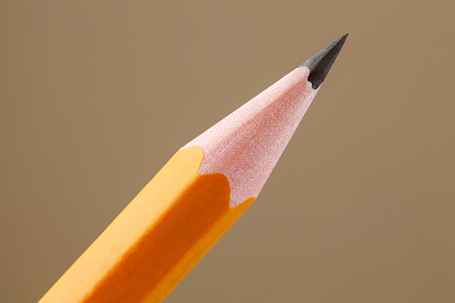 Pencil simple, sharpened tip of graphite kernel, close-up macro view