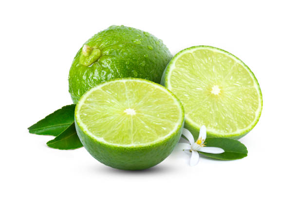 istock Lime fruits with green leaf isolated on white 1338077899