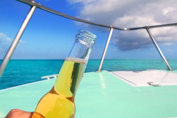 istock beer on Caribbean boat bow deck turquoise sea 1338084893