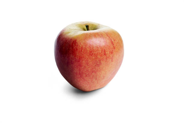 A juicy red apple isolated against a white.