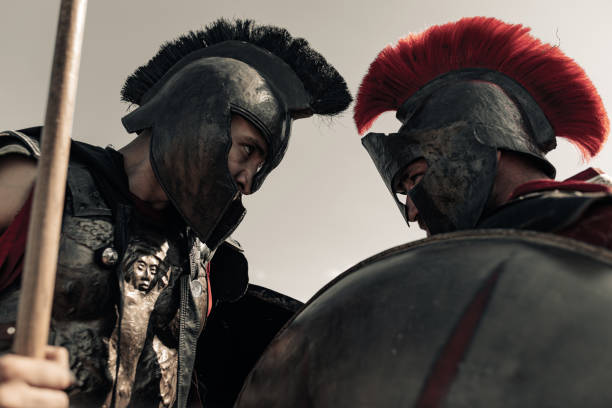 istock Duel between two ancient warriors in battle dress with shields and spears. 1338089728