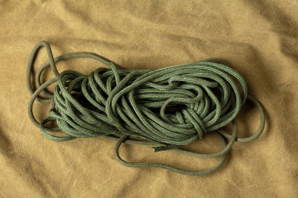 Skein of paracord on brown tent fabric. Wildlife Survival Items​​​ foto