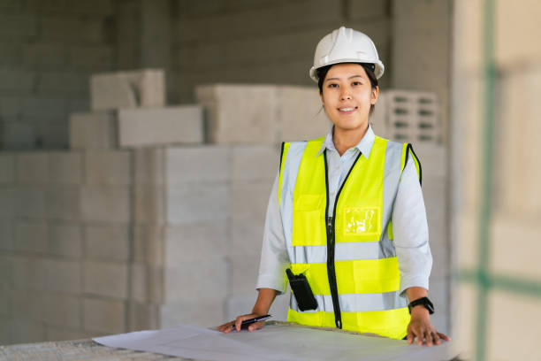 istock Portrait of young female engineer on construction site 1338090008