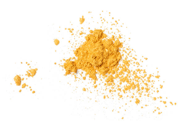 istock Heap of gold powder on white background 1338091205