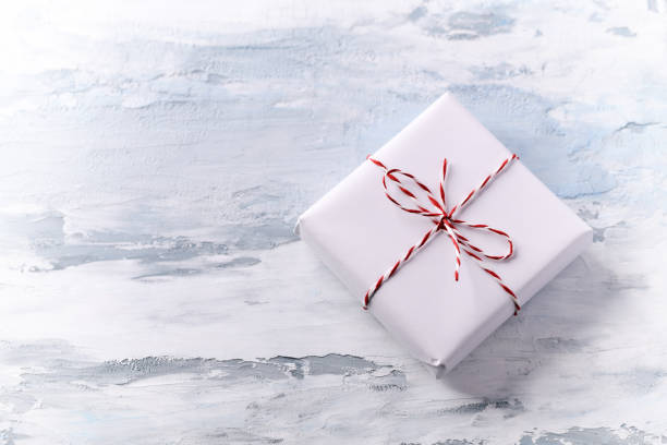 istock Christmas present on bright wooden background. Close up. Copy space. 1338094060