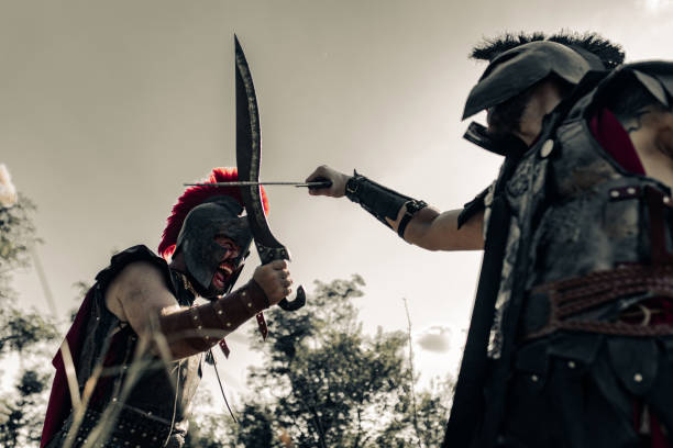 istock Battle with swords between two ancient warriors on meadow. 1338094086
