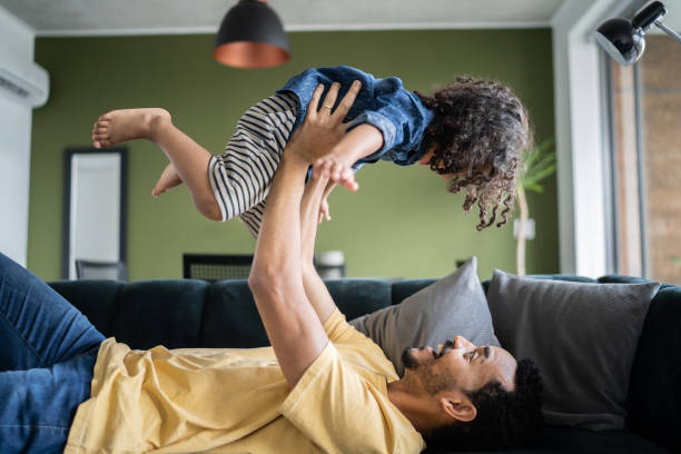 istock Father playing with son at home 1338096514