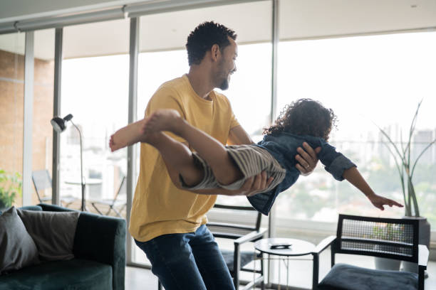 istock Father playing with son at home 1338096528