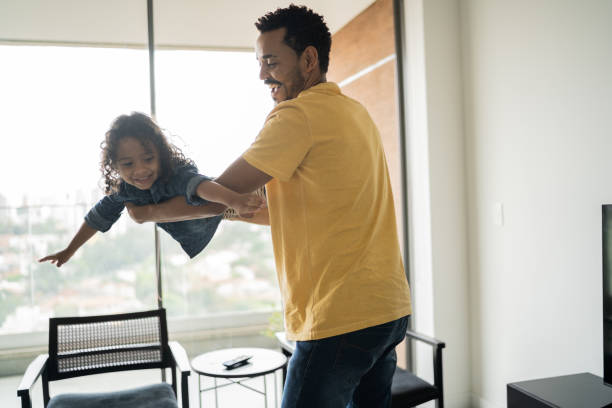 istock Father playing with son at home 1338096565