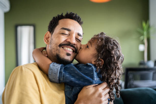 istock Father and son hugging each other at home 1338096841
