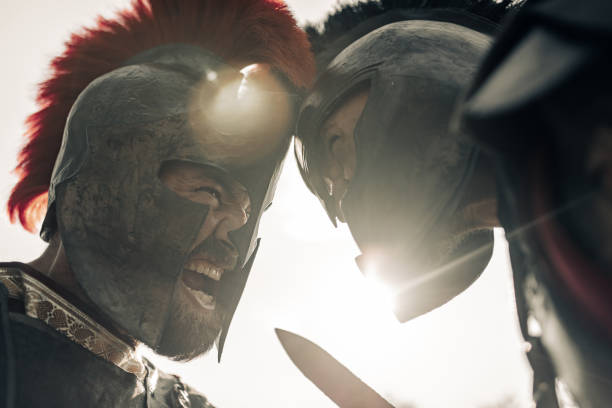 istock Duel between two screaming in rage ancient warriors in battle dress. 1338099634