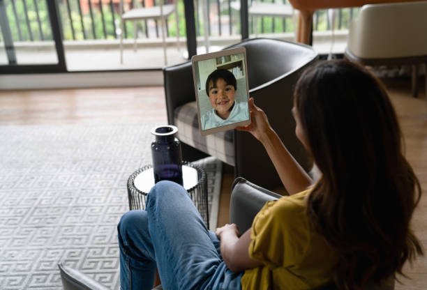 istock Woman talking with her son on a video call using her tablet 1338099823