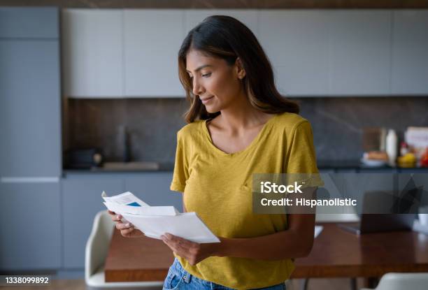 Woman At Home Checking The Mail Stock Photo - Download Image Now - Mail, Letter - Document, Financial Bill