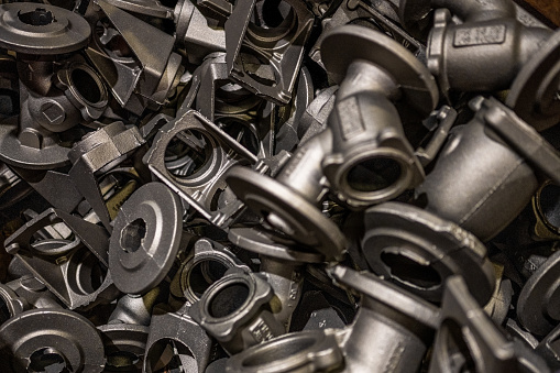 Close-up of metal equipment's manufactured from recycled metal in steel mill.