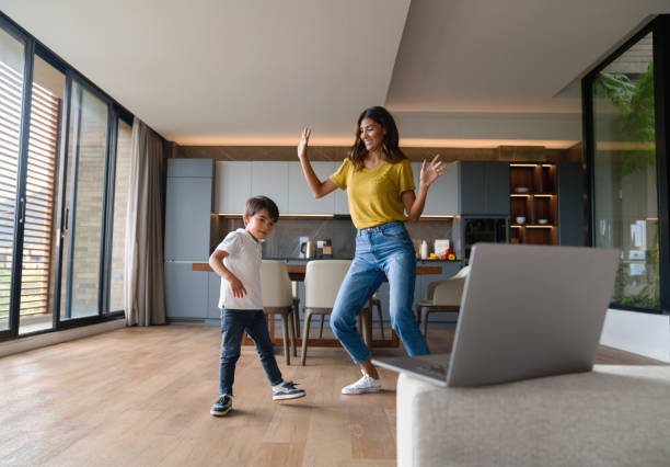 istock Happy mother and son having fun at home danci 1338106335