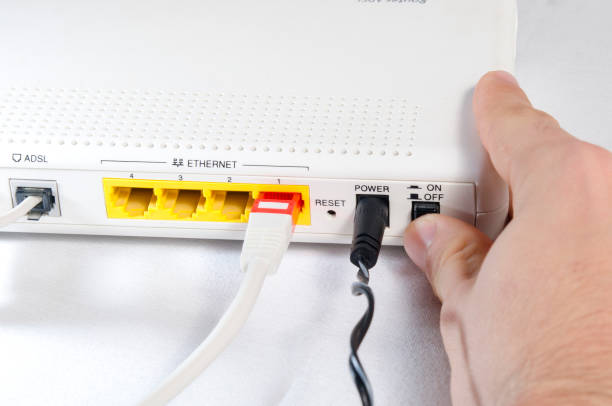 Hand while connecting a router to internet stock photo