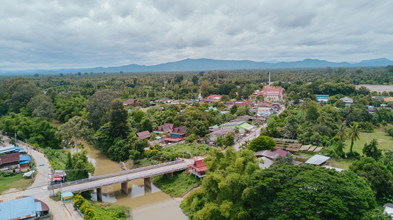 Aerial view of summer houses or village among the green forests at Petchaburi, Thailand.