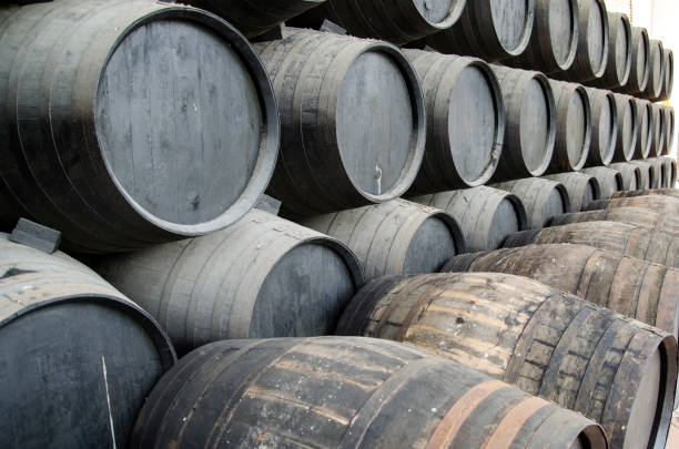 istock whiskey or wine barrels stacked in winery 1338112252