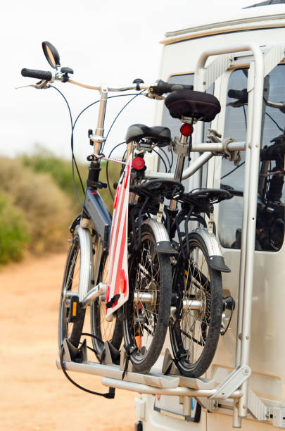 Transporting two bicycles on a car with a bicycle racks stock photo