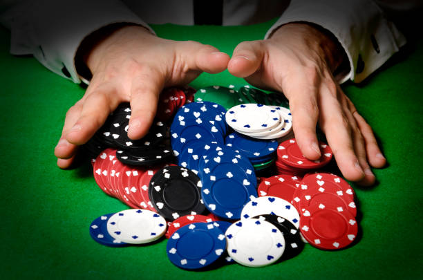 istock Hands in foreground betting in a casino 1338112982