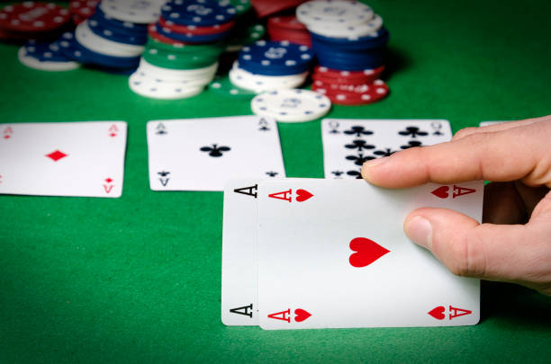 istock Closeup of poker player with two aces 1338113585
