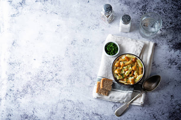 istock Roasted potato with mushrooms in a bowl 1338114015